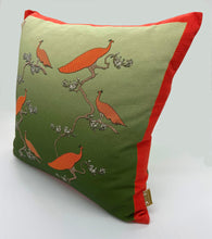 Load image into Gallery viewer, Luxe Cushion Peacocks Muster in Orange and Leaf Green on Linen/Cotton designed by Karen Bell designbybell and printed and made in Ireland sustainably on ecofriendly pigment inks
